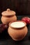 Fresh lassi in traditional indian clay pot.
