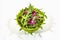 Fresh leaves of arugula and radicchio isolated on white background. Green bamboo salad bowl. Healthy food concept