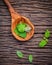 Fresh lemon balm ( Melissa tincture) leaves in spoon setup with