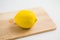 Fresh lemon on the chopping block, isolate background.