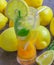 Fresh lemonade in a glass with slices of lemon, apricot, mint an