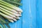 Fresh lemongrass or citronella grass leaf on blue wooden plank