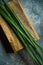 Fresh lemongrass or citronella grass on rustic wooden board. Herb used for healthy eating