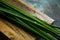 Fresh lemongrass or citronella grass on rustic wooden board. Herb used for healthy eating