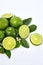 Fresh limes green slice with limes leaves and limes flowers isolated on white background