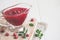 Fresh Lingonberry sauce in a gravy boat closeup, copy space