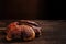 Fresh Lingzhi mushroom on dark wooden floor.