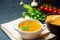 Fresh liquid pea soup on chicken broth. bean soup with parsley. healthy breakfast. black concrete background. selective focus.