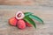 Fresh litchi fruit on an old wooden background