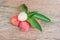 Fresh litchi fruit on an old wooden background