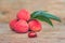 Fresh litchi fruit on an old wooden background