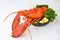 Fresh lobster food on a bowl and white table background - red lobster dinner seafood with herb spices lemon rosemary served table