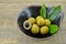 Fresh longan in bowl on wooden background