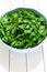 Fresh lovage in a plastic bowl