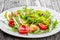 Fresh low-calories salad with chicken breast, arugula and tomato