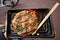 Fresh made japanese okonomiyaki as street food in Osaka