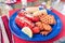 Fresh Maine lobster tail on a plate prepared with butter, corn and potato fries