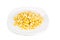 Fresh maize corn kernels on plate against white background