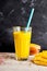 Fresh mango smoothie on a rustic counter