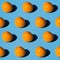 Fresh mangoes pattern on a light blue background. Isometric view with hard lights. Natural bio fruits concept