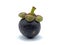 Fresh mangosteen with dark purple spheres and antioxidants, which help to slow down aging and wrinkles.