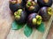 Fresh mangosteen fruit on wood