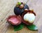 Fresh mangosteen fruit on wood