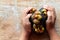 Fresh mangosteens in my hand on wood background, Ripe fruits a sweet tasty