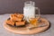 Fresh milk in glass and sweet cookies with honey