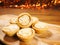 Fresh mince pies on a wooden board. Traditional Christmas pastry product. Warm glitter bokeh background