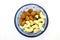 Fresh Mixed Almonds and Cashew nuts in a blue bowl, Top view. White isolated background