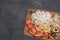 Fresh mixed seafood on wood desk isolated on gray background. Shrimp, squid rings, scallop