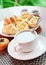 Fresh muffins and tea with milk, breakfast