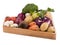 Fresh multi-colored vegetables in wooden crate. Organic food. White background