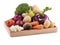 Fresh multi-colored vegetables in wooden crate. Organic food. White background