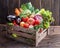 Fresh multi-colored vegetables in wooden crate. Wooden background.
