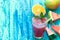 Fresh multifruit smoothie in a glasses with a straw on a blue wooden rustic background