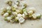 Fresh mung sprouts on wooden background close up