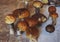 Fresh mushrooms boletus , krasnoholovets , volnushki. in the basket , hardwood table