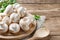 Fresh mushrooms champignon mushrooms on a wooden table