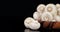 Fresh mushrooms in wooden plate falling water drops.