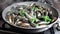 Fresh mussels in the pan
