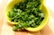 Fresh and natural chopped parsley in yellow dish