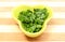 Fresh and natural chopped parsley in yellow dish