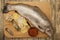 Fresh Norwegian rainbow trout with lemon red caviar, and onions on a wooden background