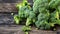 Fresh, Nutritious Green Broccoli Laid Out on a Wooden Kitchen Board