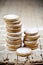 Fresh oat cookies stacks with sugar powder closeup on rustic wooden table