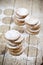 Fresh oat cookies stacks with sugar powder on rustic wooden table