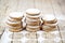 Fresh oat cookies stacks with sugar powder on rustic wooden table