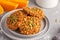 Fresh oatmeal pumpkin cookies on a gray plate, halloween food, a